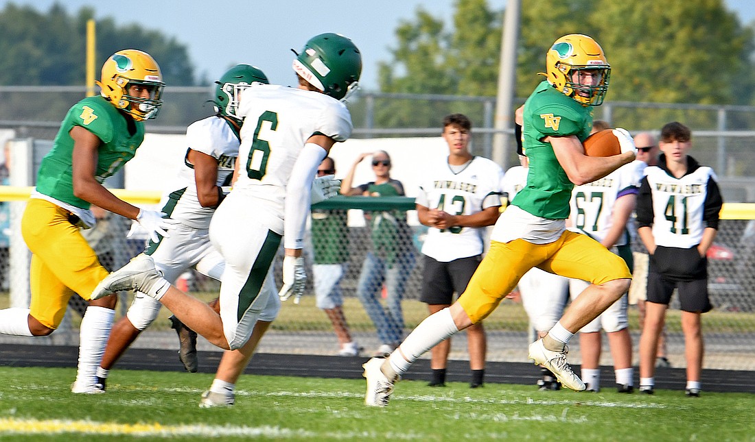 Junior Wes Parker of Tippecanoe Valley races down the sideline during the game's first series of downs to score Valley's first touchdown of the season...Nieter