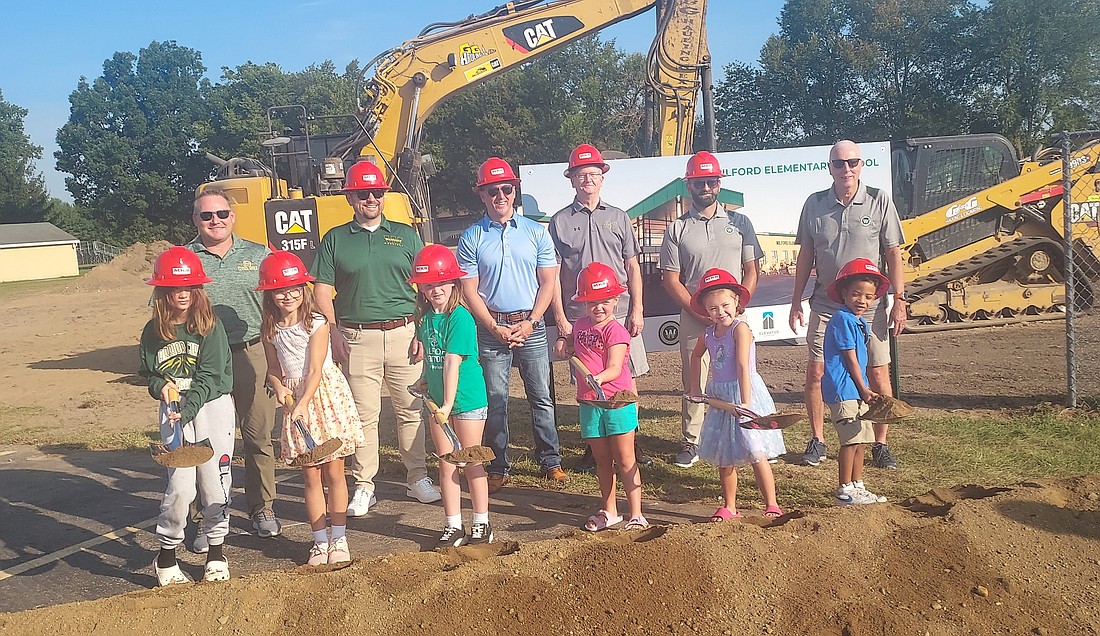 Pictured (L to R) are, back: Wawasee School Board member Andy Cripe, Wawasee Community School Corporation Superintendent Dr. Stephen Troyer and board members Don Bohkart, Steven Baut, Neil Likens and Mike Wilson; front: Milford Elementary School students Elliese Hartter, Avery Haynie, Charlotte Rice, Amelia Griepentrog, Avannah Price and Lorian Ferguson. Photo by Jackie Gorski, Times-Union