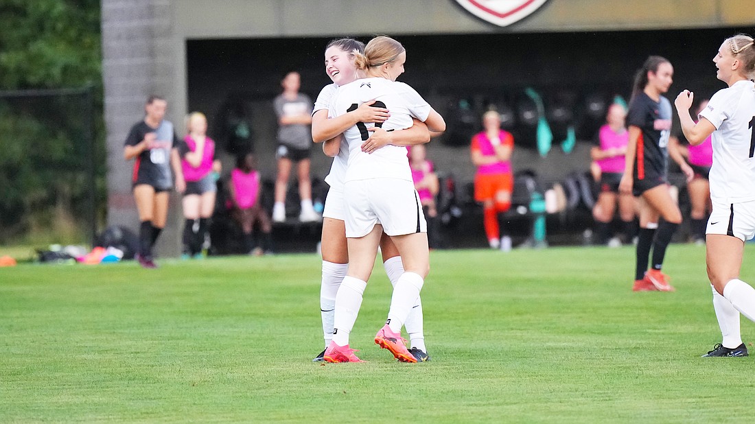 pictured are Audrey Abel (left) and Abby Hodkin celebrating a goal during Grace's win over Indiana Tech on Wednesday.