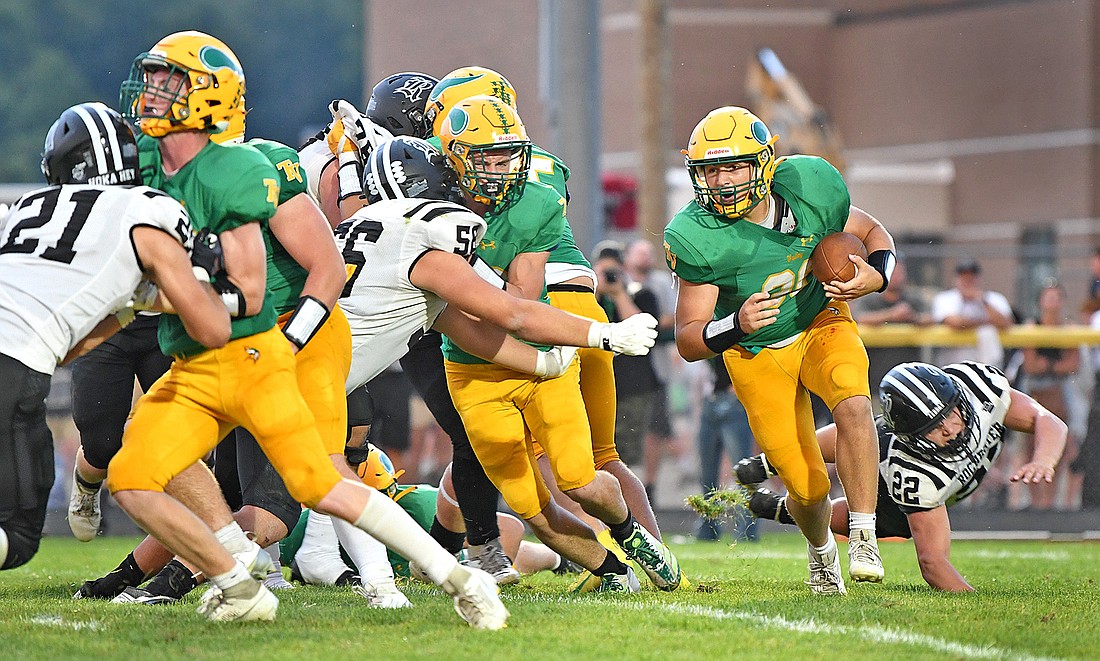 Junior Grady Moriarty turns the corner while following his blockers to set up Valley's first touchdown at the end of the first half...Nieter