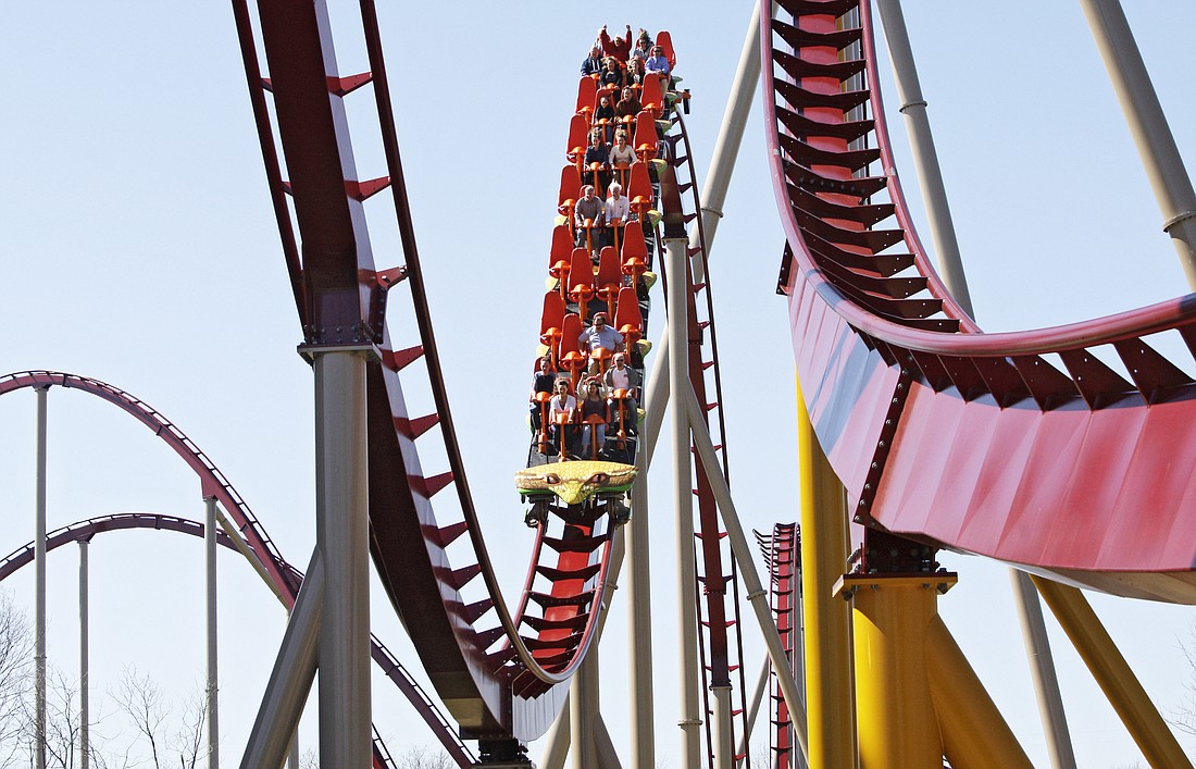 In this  April 17, 2009 photo, guests ride on the Diamondback roller coaster at Kings Island Amusement Park in Mason, Ohio.