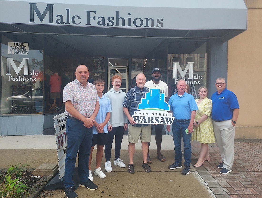 Pictured (L to R) are Scott Wiley, supporter relations manager for Main Street Warsaw; Ashton Ault and Tim Opferman, employees of Male Fashions; Tim Hamann, owner of Male Fashions; Shaun Brown, Kosciusko Chamber of Commerce ambassador; Terry Sweeney, Main Street Warsaw director of development; Cindy Dobbins, Warsaw Common Council and downtown business owner; Nora Christiansen, event coordinator for the Chamber and Main Street Warsaw; and Rob Parker, executive director for Main Street Warsaw. Photo by Jackie Gorski, Times-Union