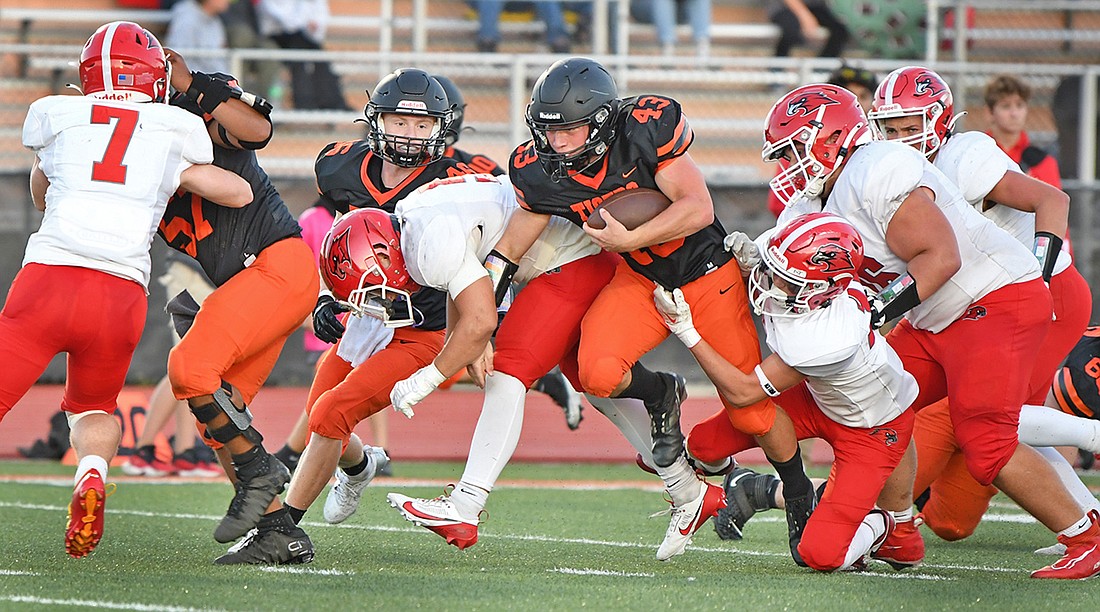 Warsaw junior Brody Duncan plows his way through the Goshen defense during the second quarter...Nieter