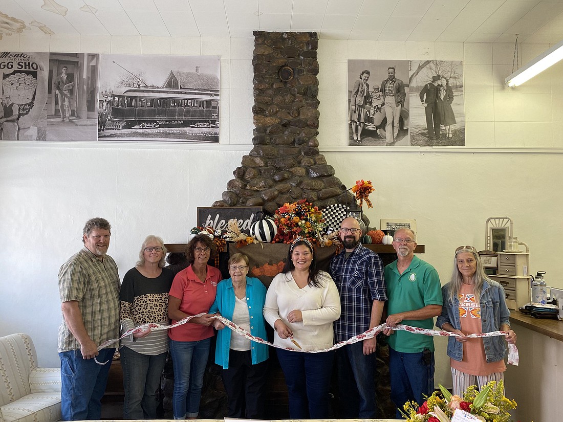 The Mentone Chamber of Commerce had a ribbon-cutting for The Hoosier Vintage on Saturday, Sept. 7. The business, which sells antiques and handmade items from Indiana, is located at 108 E. Main St. Pictured (L to R) are Chamber members Jeremy Lybarger and Krystal Lybarger; Chamber Treasurer Karen Francis; Chamber President Rita Price Simpson; The Hoosier Vintage owners Lindsay and Nick Witwer; Chamber Vice President Tim Croy; and Chamber member Anna Boggs. Photo by Leah Sander, InkFreeNews