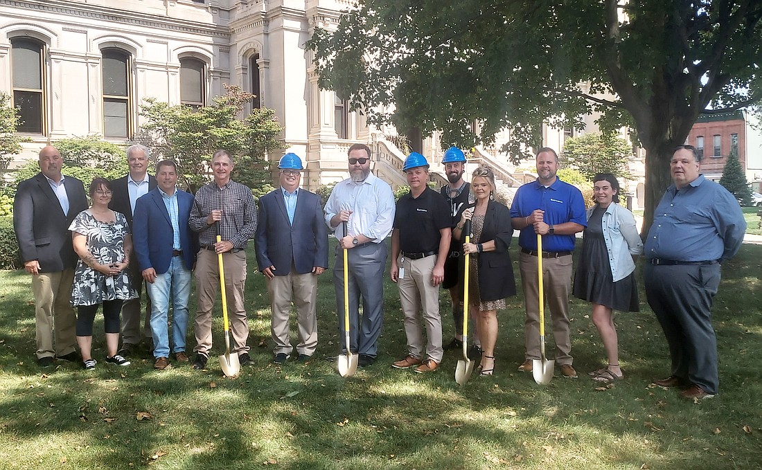 Representatives of Surf Internet, the city of Warsaw and Kosciusko Chamber of Commerce staff and ambassadors pose for a photo Tuesday. Photo by Jackie Gorski, Times-Union