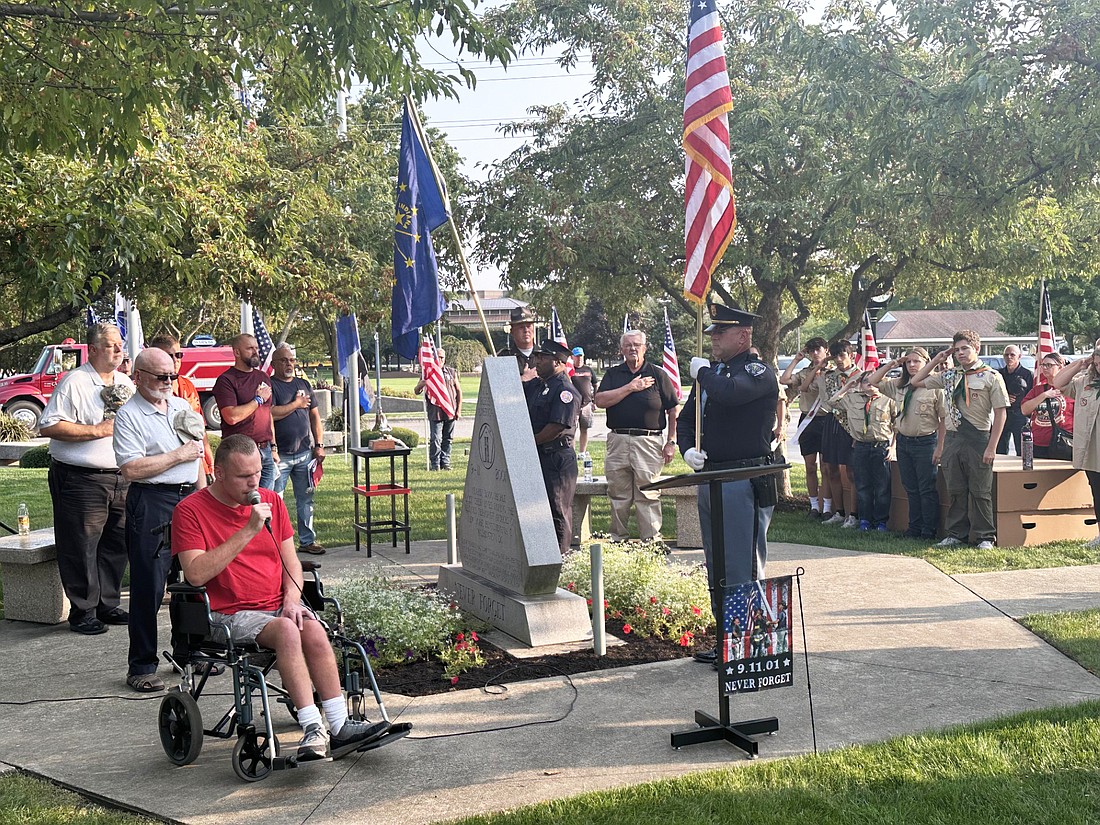 Bryce Lippe (L) sings the national anthem at the Sept. 11 ceremony at the 9/11 Monument in Central Park Wednesday. Photo by David Slone, Times-Union