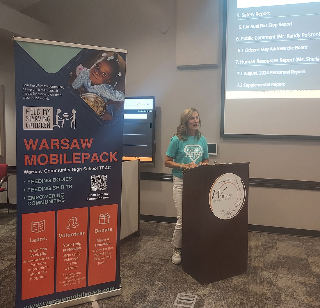 Megan Stone, chair of the Feed My Starving Children MobilePack event, speaks to the Warsaw School Board Monday. Photo by Jackie Gorski, Times-Union