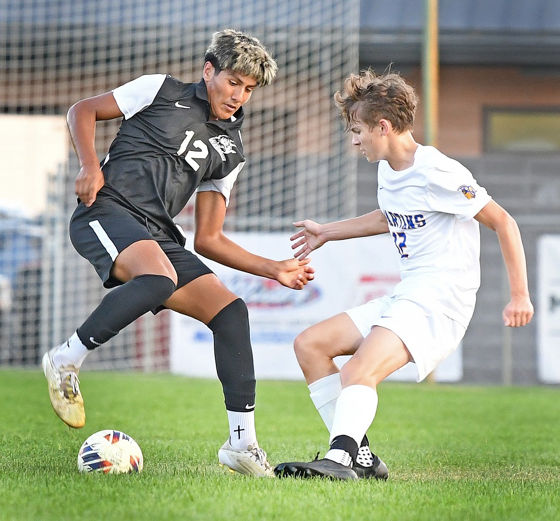 Senior Miguel Cacahua does some fancy footwork to maintain ball control during the first half of Wednesday night's home game against Homestead...NIeter