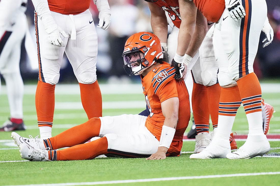 Chicago Bears quarterback Caleb Williams is slow to get up after being sacked by Houston Texans defensive end Will Anderson Jr. during the second half of an NFL football game Sunday, Sept. 15, 2024, in Houston. (AP Photo/Eric Gay)