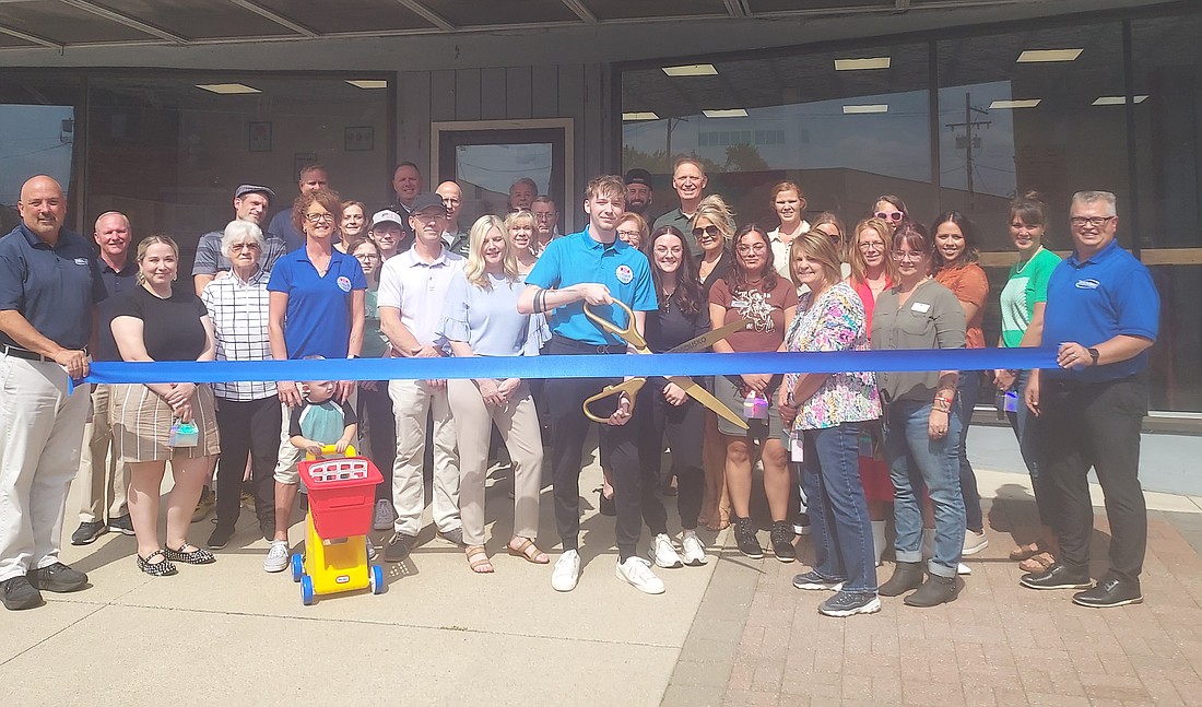 The Kosciusko Chamber of Commerce held a ribbon-cutting for Downtown Candy & Soda Shoppe, 112 W. Market St.,  Warsaw, Friday. Pictured are Downtown Candy owners Ernie and Sheila Strickland, Manager Jaiden Strickland, Chamber staff and ambassadors and other community members. Photo by Jackie Gorski, Times-Union