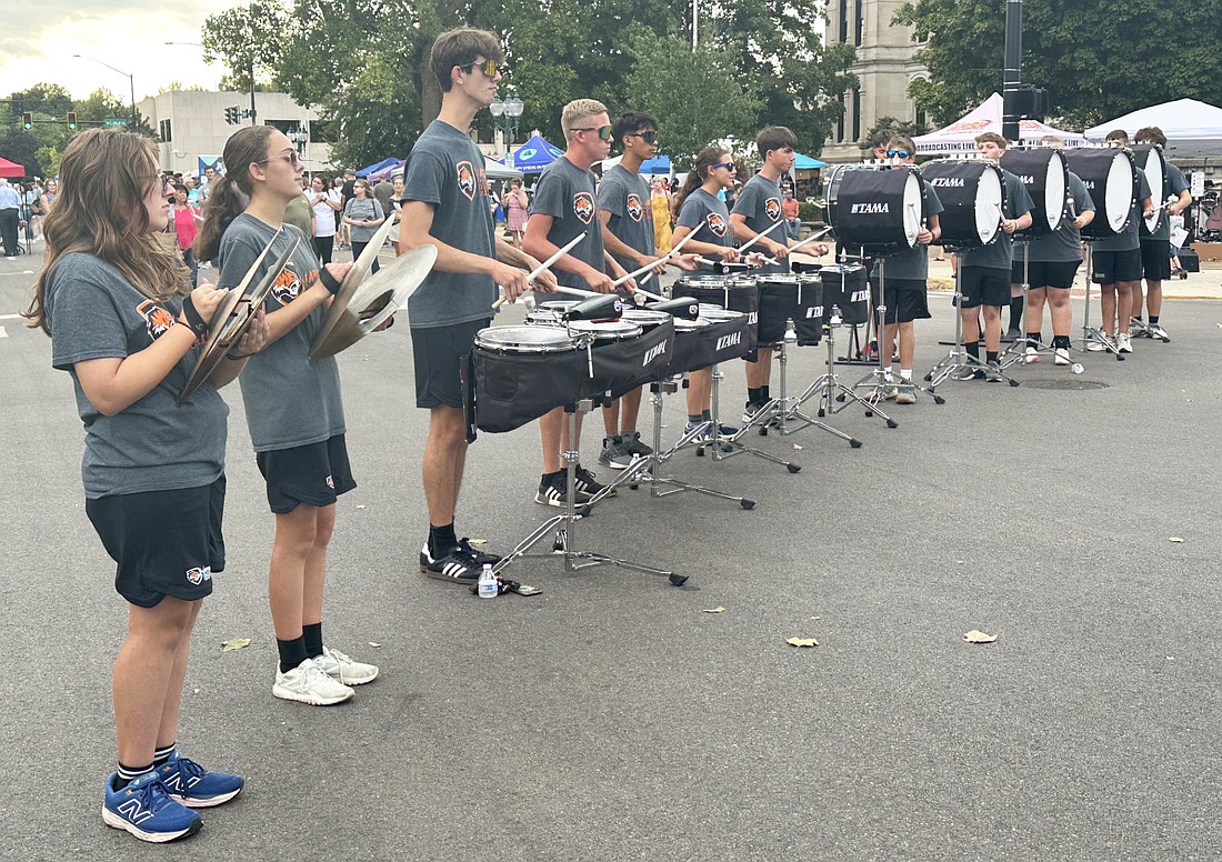 The Warsaw Community High School Marching Band drumline performs at Third Friday downtown Warsaw on Friday. Photo by David Slone, Times-Union