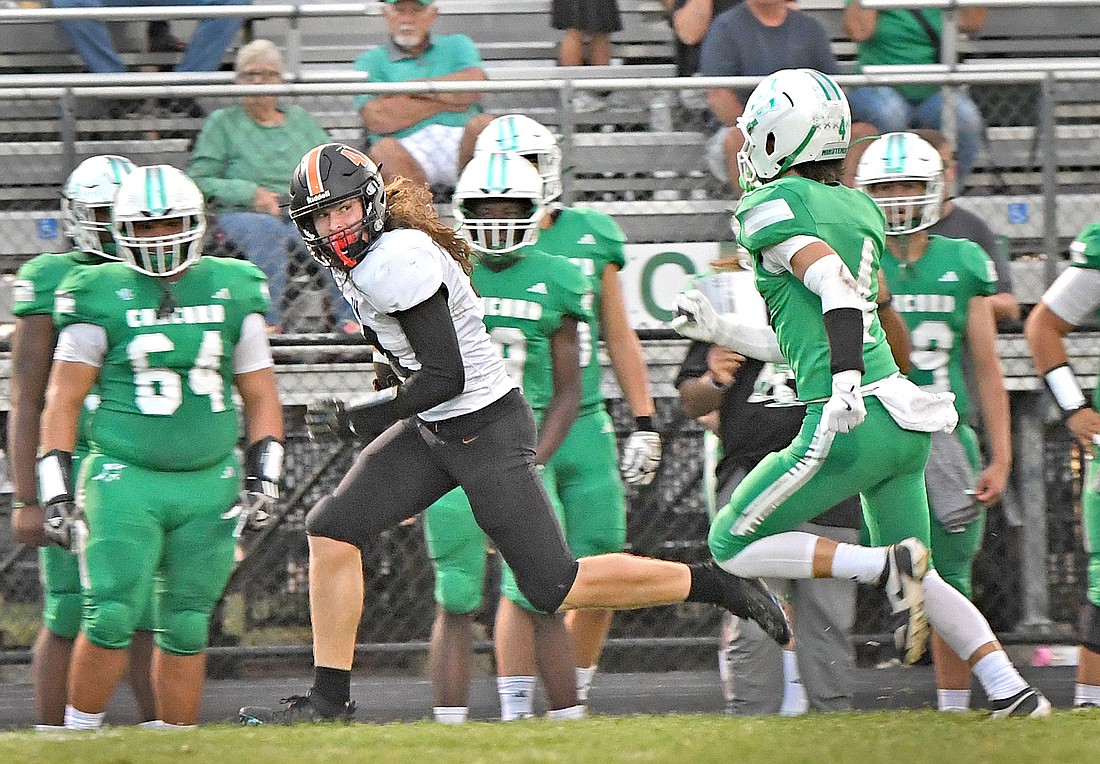 Senior Ethan Egolf  of Warsaw takes off down the Concord sideline after making a catch during Friday night's game at Concord...Nieter