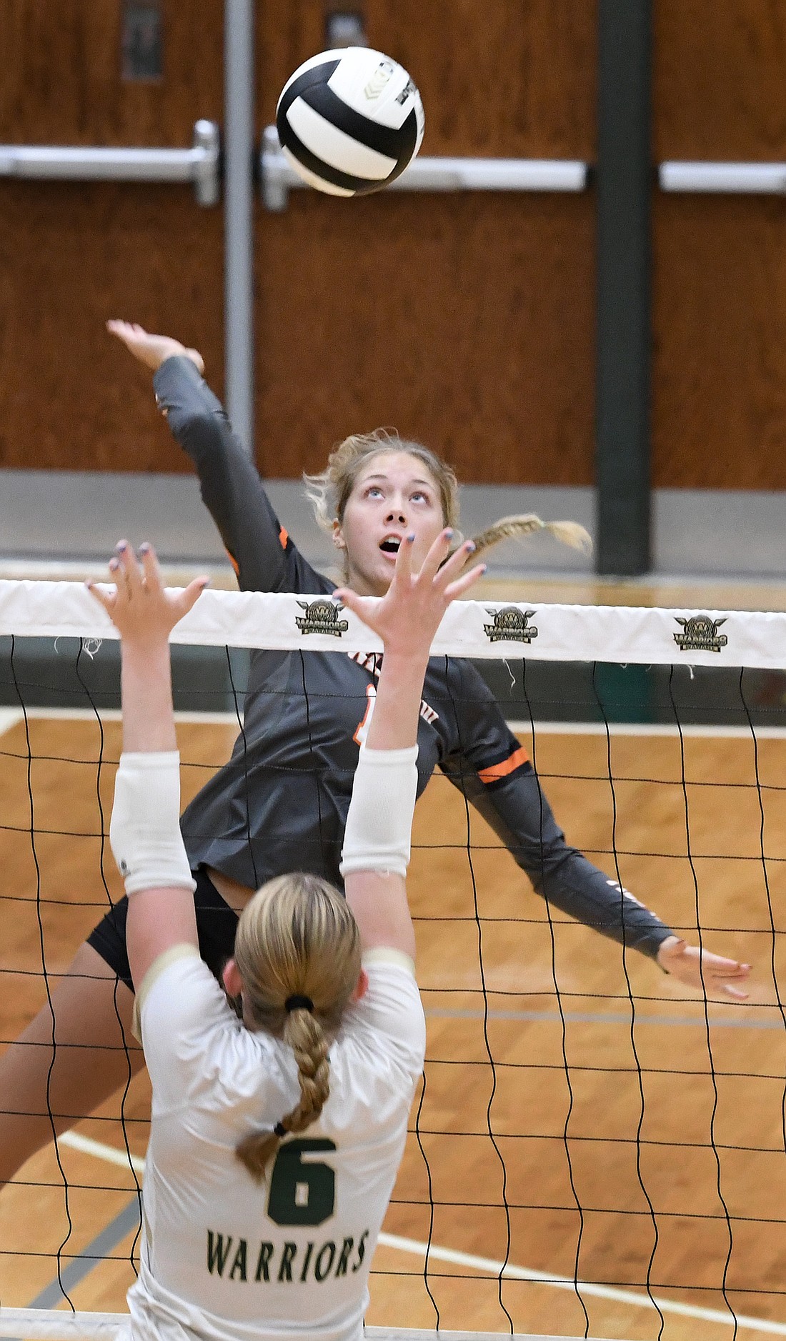 Senior Allison Chapman of Warsaw goes for a kill during the first set...Nieter