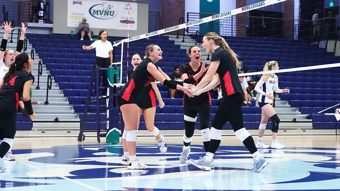 Pictured is Grace's volleyball team enjoying a pivotal point during an upset victory at No. 16 Mt. Vernon on Wednesday.