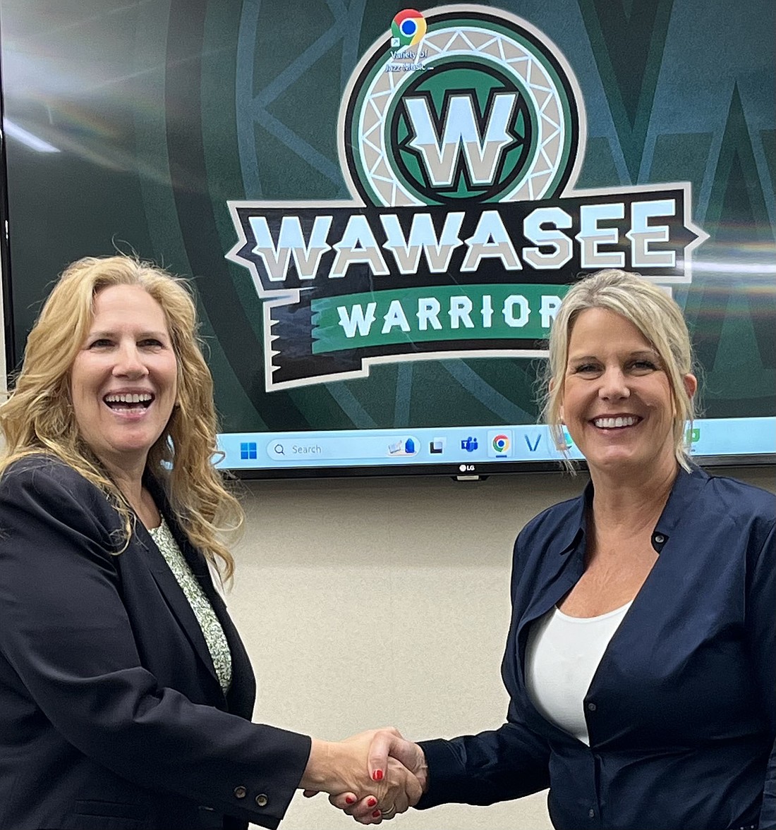 Pictured (L to R) are DeeAnna Muraski, executive director, Operation Read; and Karen Brock, principal, Syracuse Elementary School. Photo Provided.