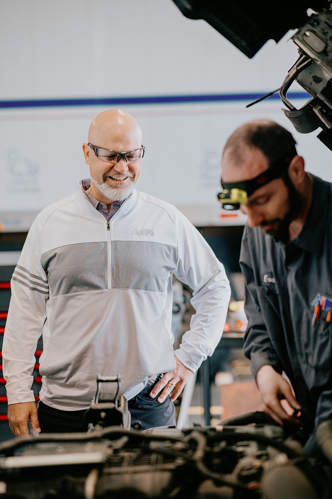 Aim President, Scott Fleming (L), visits with one of Aim’s diesel technicians. Photo Provided