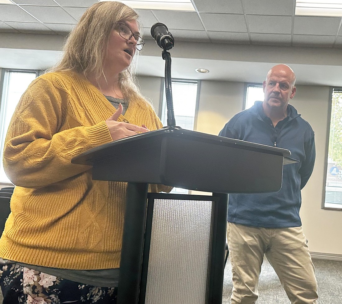 Heidi Blake (L), Kosciusko Coalition on Drug Education coordinator, speaks to the Warsaw Board of Public Works and Safety Friday after Warsaw Police Department Chief Scott Whitaker (R) requested the city’s remaining restricted opioid settlement funds budgeted for 2024 be donated to K-CODE. Photo by David Slone, Times-Union