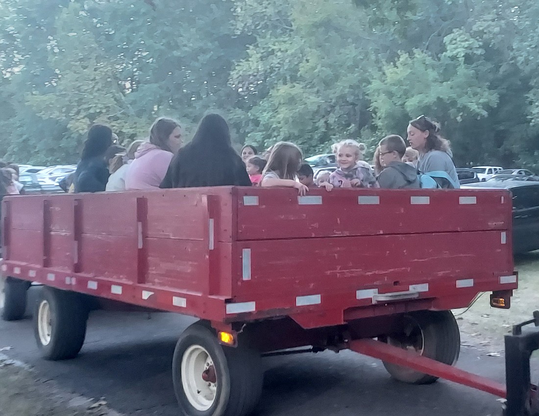 People take a hayride trip during Friday’s Fall Family Fun event. Photo by Jackie Gorski, Times-Union