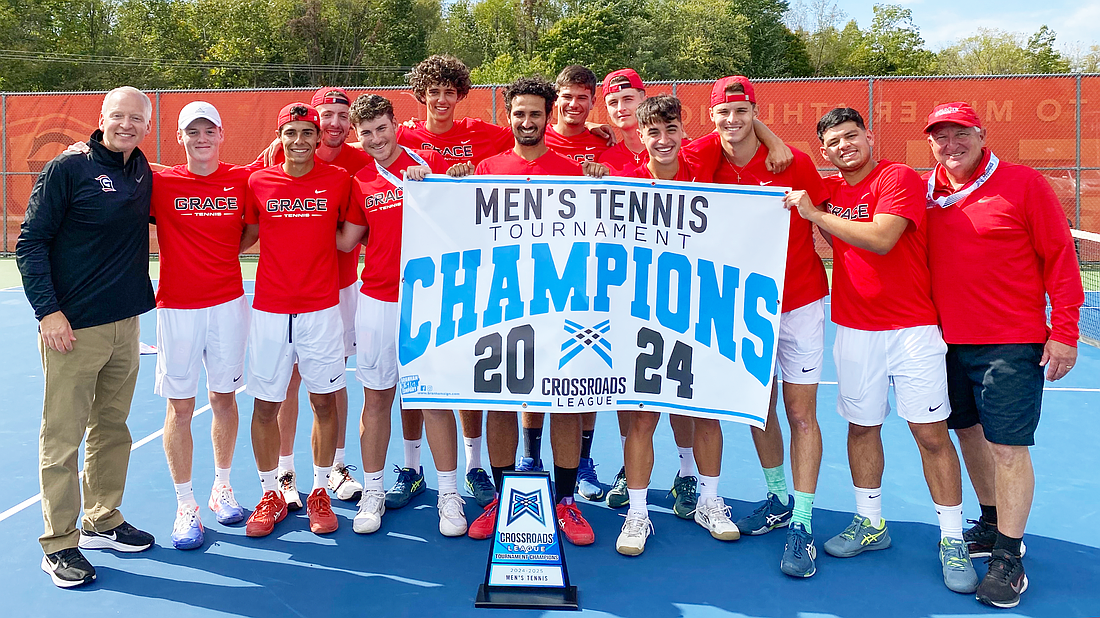 Pictured is Grace's men's tennis team with the trophy and banner.