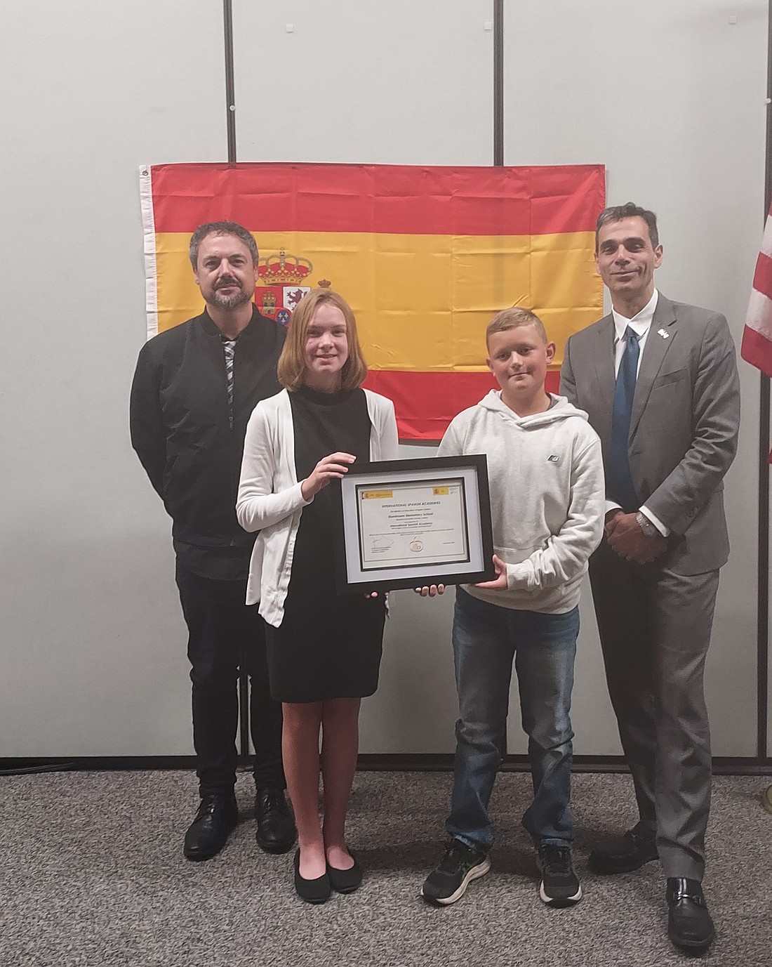 Pictured (L to R) are Indiana University Indianapolis Director of the Spanish Resource Center Juan Lago, Eisenhower students Cecilia King and Parker Sale and Dr. Diego Blázquez, the education attaché for the Consulate General of Spain. Photo by Jackie Gorski, Times-Union