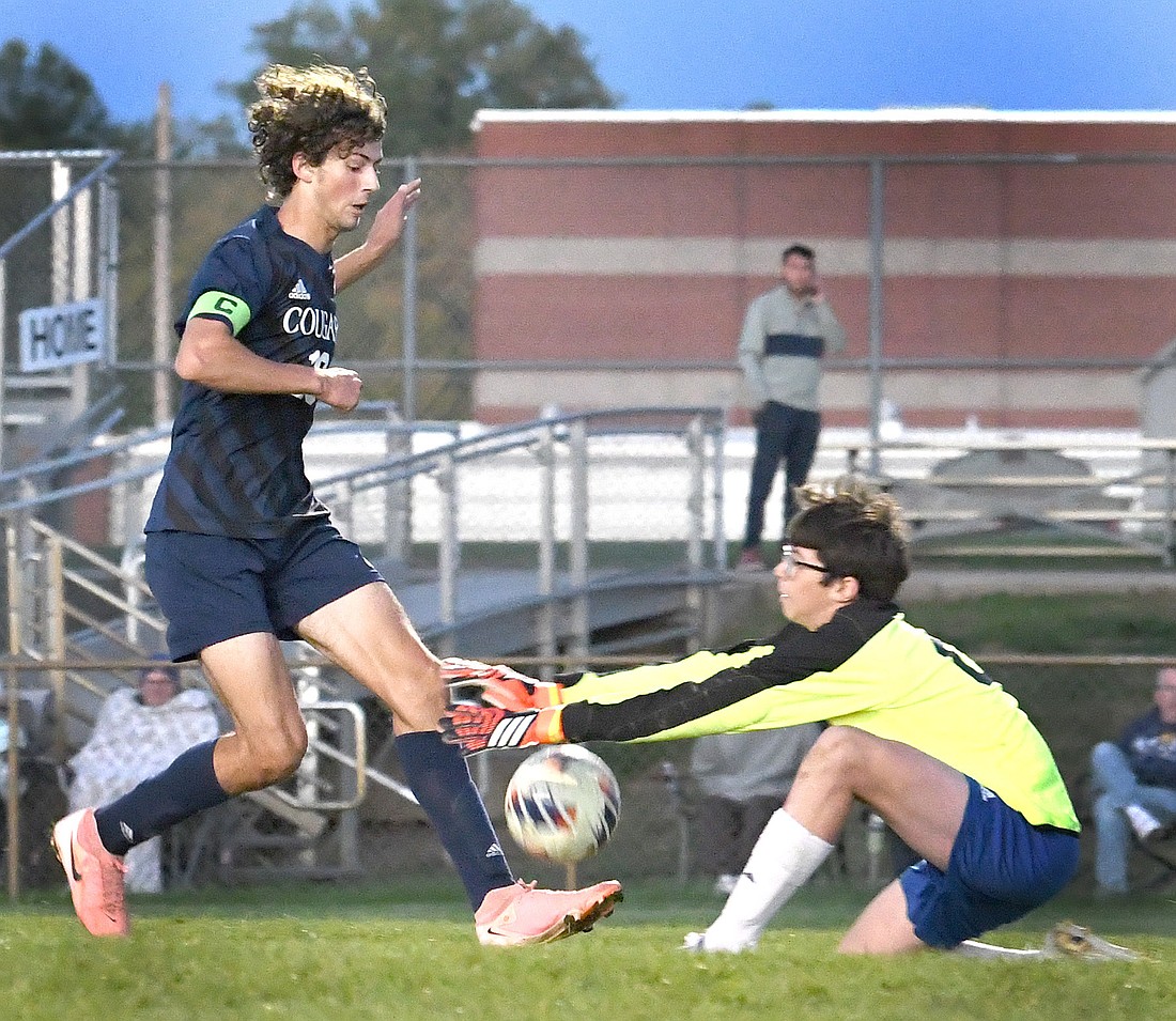 Caston goalie Kaemen Lee manages to fend off the shot-on-goal attempt  of LCA's Aiden Yoder in the first half...Nieter