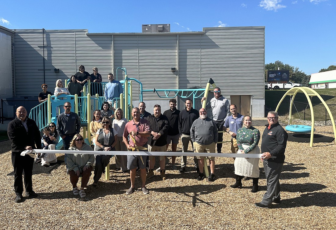 Kosciusko Chamber of Commerce held a ribbon-cutting ceremony Tuesday for the new playground at Baker Youth Club, 1401 E. Smith St., Warsaw. Pictured are Chamber staff and ambassadors, along with BYC staff and board of directors members. Photo by David Slone, Times-Union