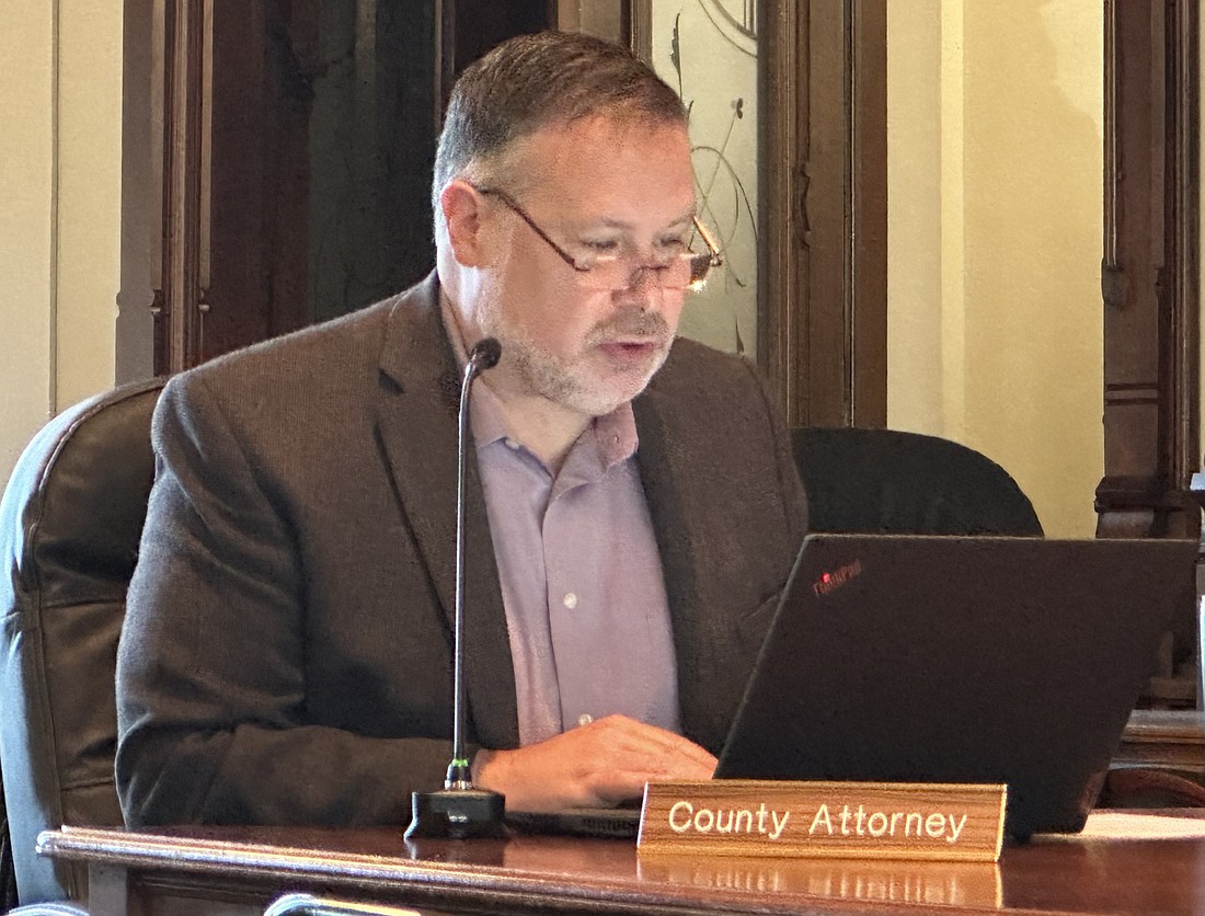 Kosciusko County attorney Ed Ormsby explains the memorandum of understanding between the county and the city of Warsaw for $500,000 toward capital improvement projects at the Warsaw Municipal Airport. Photo by David Slone, Times-Union