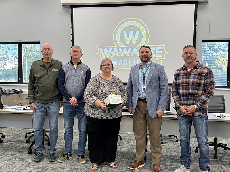 Milford School administrative assistant Beth Banghart retired Oct. 1. Pictured (L to R) are Don Bokhart, Mike Wilson, Banghart, Dr. Steve Troyer and Steve Baut. Photo by Marissa Sweatland, InkFreeNews