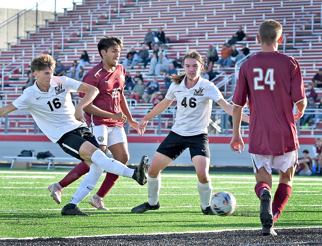 Senior Tanner Reynolds eyes the goal while kicking in Warsaw's second goal of the match...Nieter