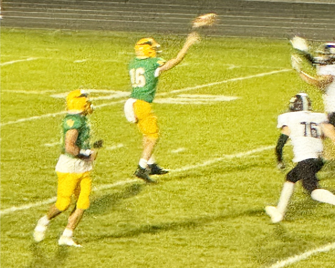 Tippecanoe Valley quarterback Hunter Stage releases the ball while throwing a screen pass during the second quarter.