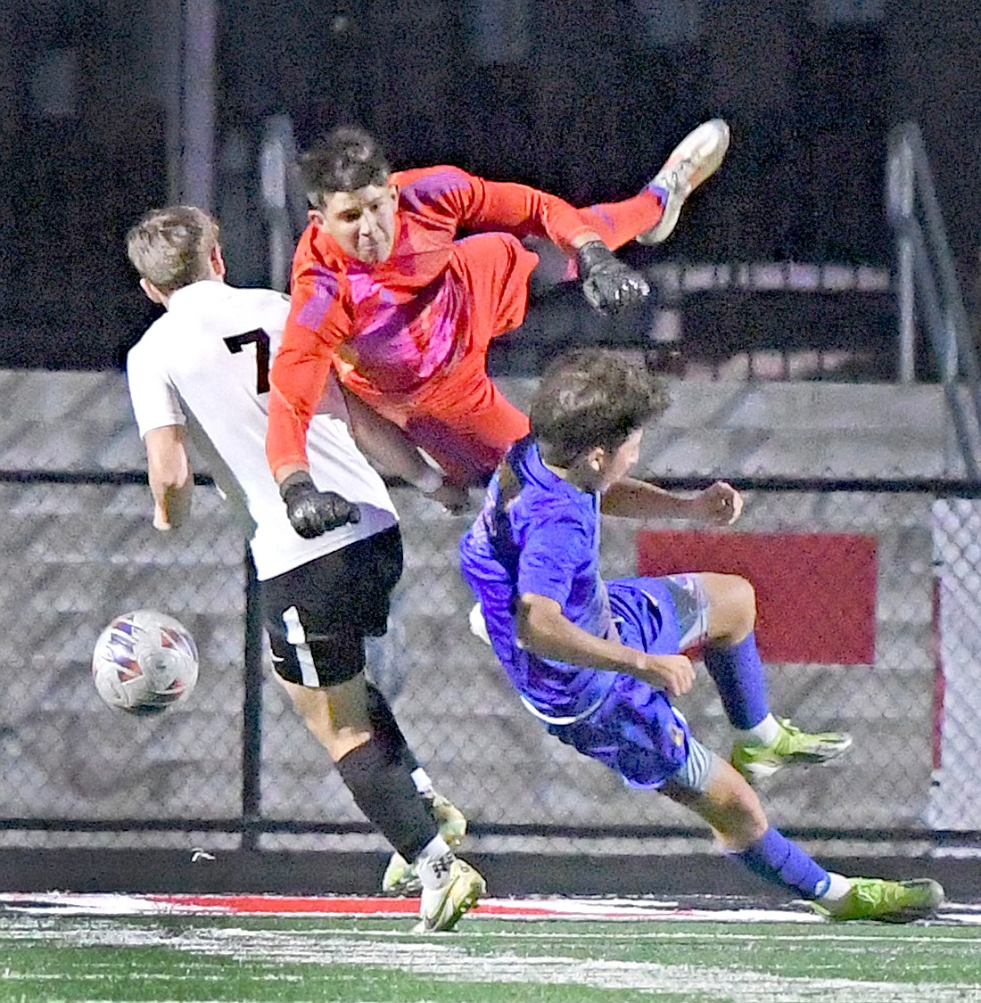 Saturday's sectional championship game proved to be quit physical between Homestead and Warsaw as Warsaw senior goalie Finley Bailey takes a hard hit while making a save.