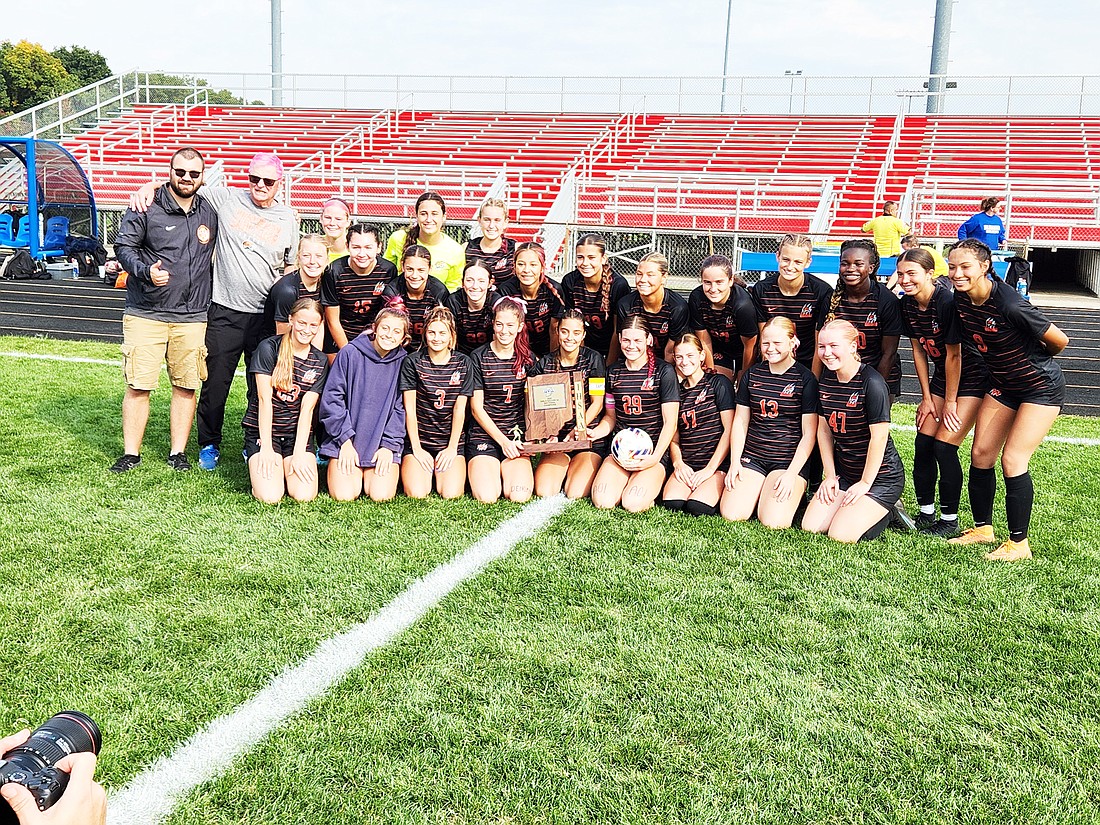 The Warsaw girls soccer team celebrates after defeating Concord 4-1 Saturday at Elkhart for its first sectional title in seven years. Photo by Anthony Anderson