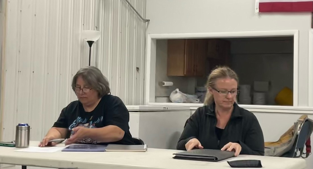 Sidney Town Councilwomen Rebecca Adams (L) and Sharon Rancourt review a handout about the strategic planning process from Michiana Area Council of Government. Photo by Madison Hart, InkFreeNews