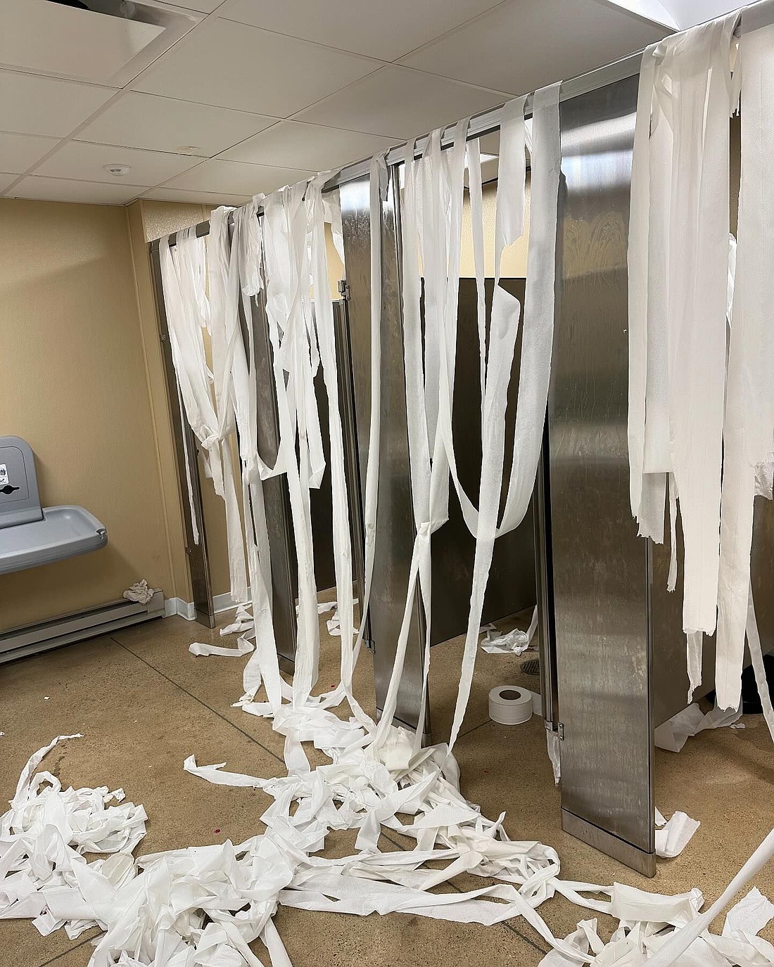 Toilet paper hangs off bathroom stalls at the Zimmer Biomet Center Lake Pavilion following vandalism there on Monday. Warsaw Parks and Recreation Department Superintendent Larry Plummer noted damage is estimated at $1,300 to $1,500. Photo Provided.