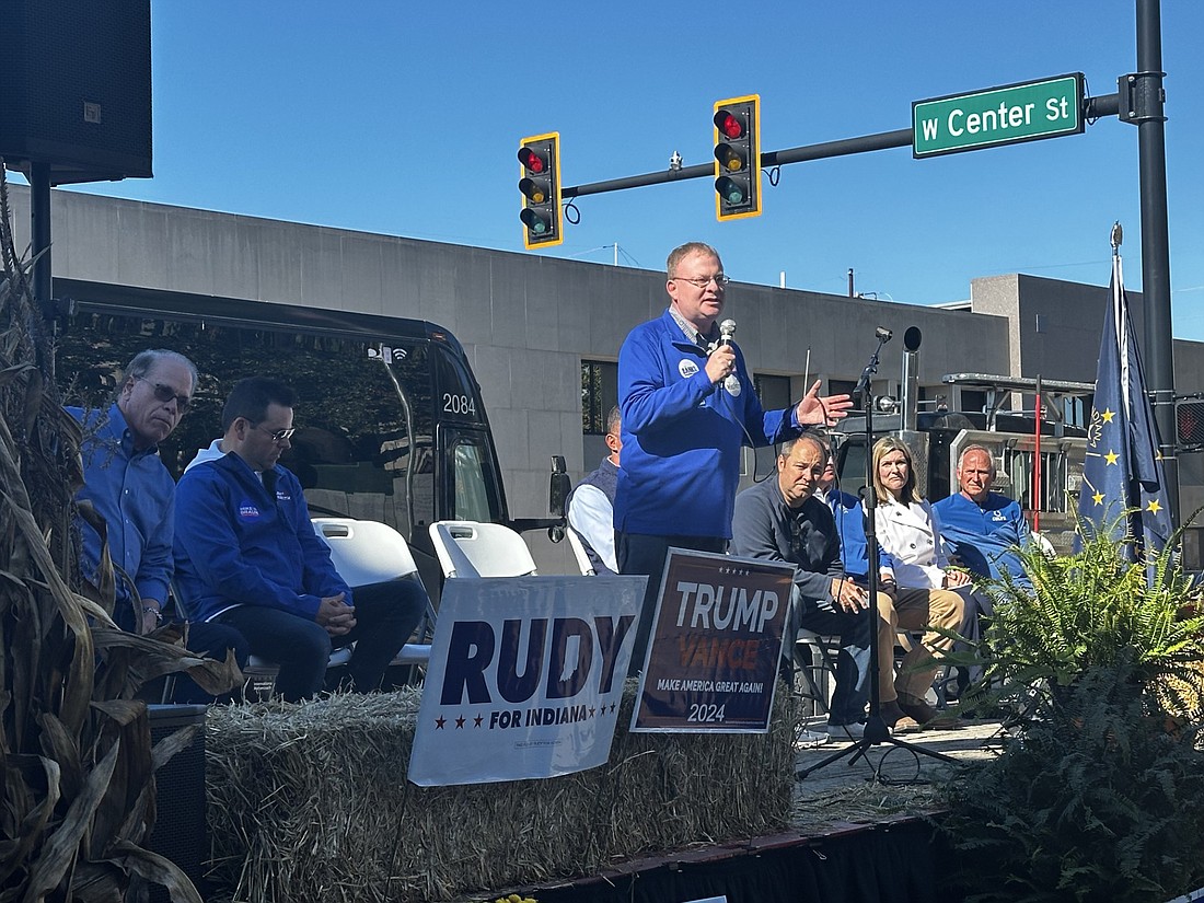 Indiana Republican Party Chairman Randy Head encourages Republicans to get out the vote Saturday morning during the GOP "Freedom and Opportunity" Bus Tour stop in downtown Warsaw. Pictured sitting behind him are (L to R) U.S. Senator and Indiana governor candidate Mike Braun; Indiana lieutenant governor candidate Pastor Micah Beckwith, District 2 U.S. Congressman Rudy Yakym, U.S. House of Representatives District 3 Republican candidate Marlin Stutzman, Indiana Attorney General Todd Rokita, Indiana Comptroller Elise Nieshalla and Indiana state Rep. Craig Snow. Photo by David Slone, Times-Union