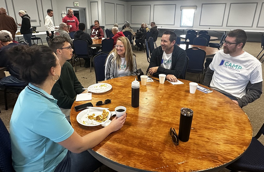 Lori Camp (C), the Democrat candidate for U.S. House of Representatives, Indiana District 2, speaks with (L to R) Leigh Anne Jessop, Van Jessop, Bob Hensell and Brian Smith Saturday morning at the pancake and sausage breakfast hosted by the Warsaw Professional Firefighters Local 5461 and United Steelworkers Local 809. Photo by David Slone, Times-Union