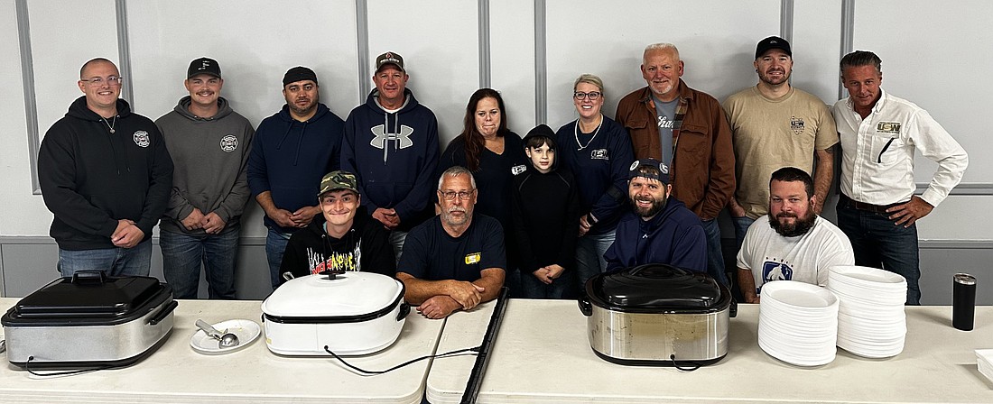 Members of Warsaw Professional Firefighters Local 5461 and United Steelworkers Local 809 pose for a group pictured toward the end of their pancake and sausage breakfast at the Shrine Building Saturday morning. Proceeds from the event benefit Warsaw Community Schools lunch programs. Photo by David Slone, Times-Union