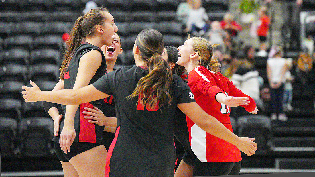 Pictured is Grace's volleyball team celebrating a point during the team's win over Spring Arbor on Saturday.