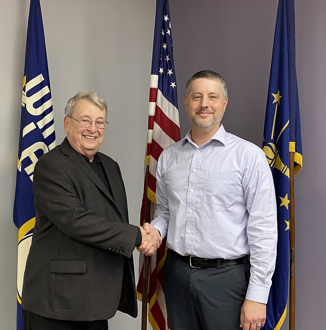 Jason Zaugg (R) was selected in a GOP caucus on Monday to replace Rick Swaim, who stepped down from his Ward 5 seat after more than eight years. Shaking Zaugg's hand is Kosciusko County GOP Chair Mike Ragan. Photo by Leah Sander, InkFreeNews