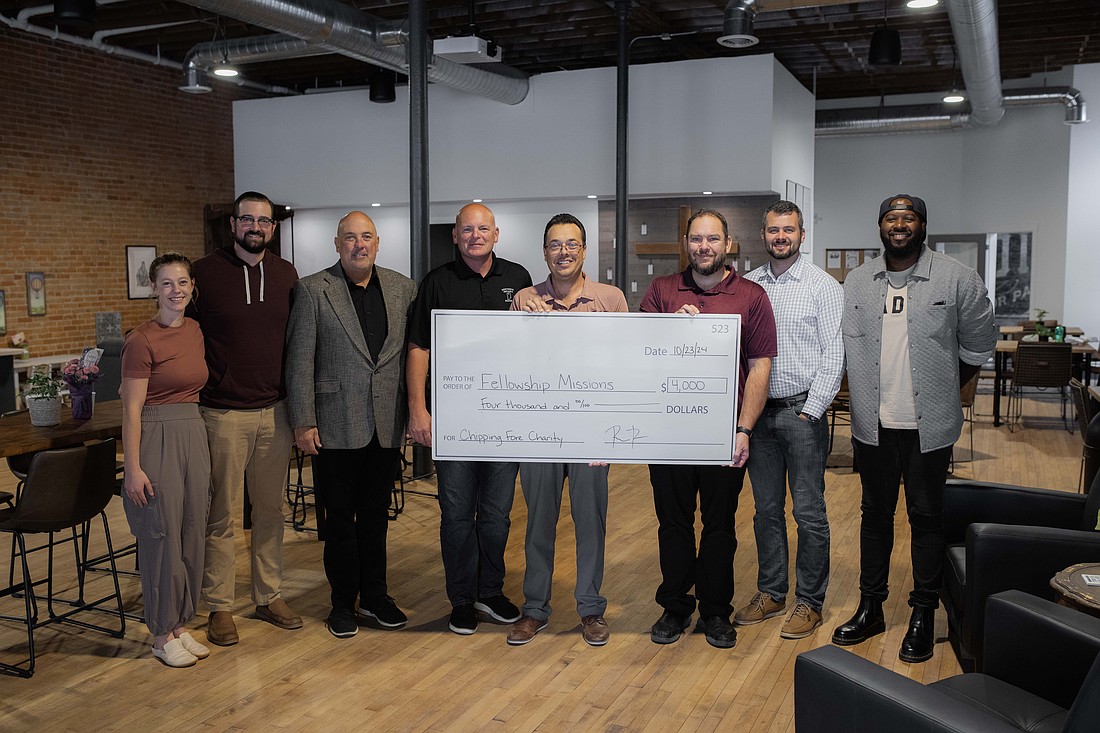 Pictured (L to R) are Savannah Beer, Young Adult Professionals (YAP) Steering Committee member; Austin Beer, YAP member; Scott Wiley, Kosciusko Chamber of Commerce; Mayor Jeff Grose, city of Warsaw; Eric Lane, Fellowship Missions executive director; Tim Frame, Fellowship Missions; Josh Silveus, YAP co-president; and Shawn Brown, YAP Steering Committee member. Photo by Lauren Klusman Twombly, Kosciusko Chamber of Commerce