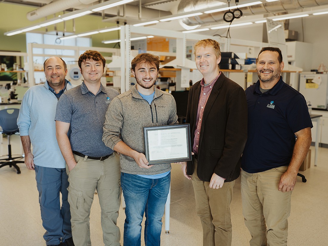 Pictured (L to R) are Dr. Joe Frentzel, Grace College Dr. Eugene Inman Endowed Chair of Science and Mathematics; Jed Harvey, Lilly Center research technician; Connor Frentzel, Lilly Center lab assistant; Dr. Nate Bosch, Lilly Center director; Matt Burlingame, Lilly Center assistant director of research. Photo Provided