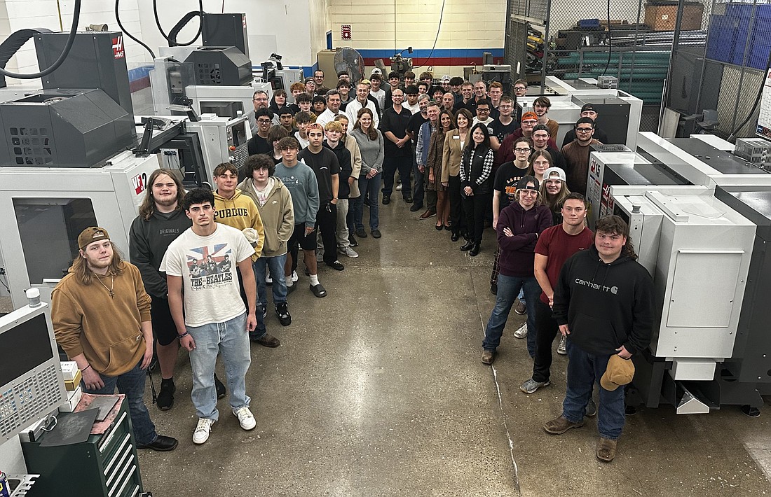 A $778,760 grant from the Don Wood Foundation to the Warsaw Area Career Center will be used to purchase new equipment and upgrade facilities for WACC’s Welding and Advanced Manufacturing programs. Pictured with Warsaw and Tippecanoe Valley students in the programs are WACC paraprofessional Craig Streby; WACC teachers Jeremiah Paseka, Nate Howett, Matt Alexander and Tom Till; Tracy Horrell, Warsaw Community Schools (WCS) assistant superintendent of secondary education; Dr. David Hoffert, WCS superintendent; Miriel McFarland, Instrumental Machine & Development LLC; Erin Serafino, talent director at OrthoWorx; Bob Vitoux, OrthoWorx CEO; Krista Polston, WCS chief communications and strategic partnerships officer; Ben Barkey, WACC director; Lisa Smith, Don Wood Foundation program officer for post-secondary attainment; and Lizette Downey, director of strategic communications for the Don Wood Foundation. Photo by David Slone, Times-Union