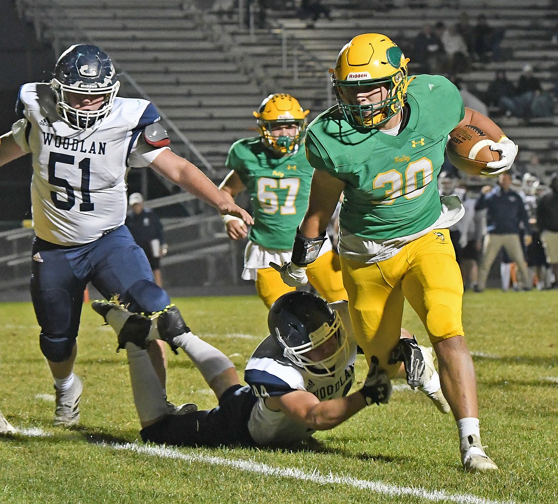 Junior Grady Moriarty heads to the end zone to score Valley's first touchdown of the night during the first quarter...Nieter