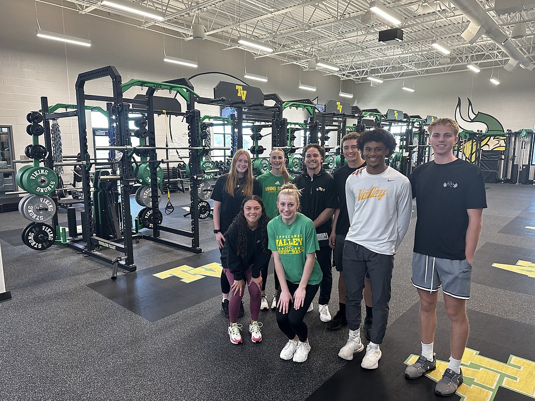 Tippecanoe Valley High School students pose in the new weight and fitness room Sunday during the public open for the school’s renovations and new construction. Photo by David Slone, Times-Union