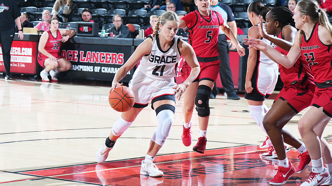 Grace’s Peyton Murphy drives to the lane during the Lady Lancers season-opening win Saturday.