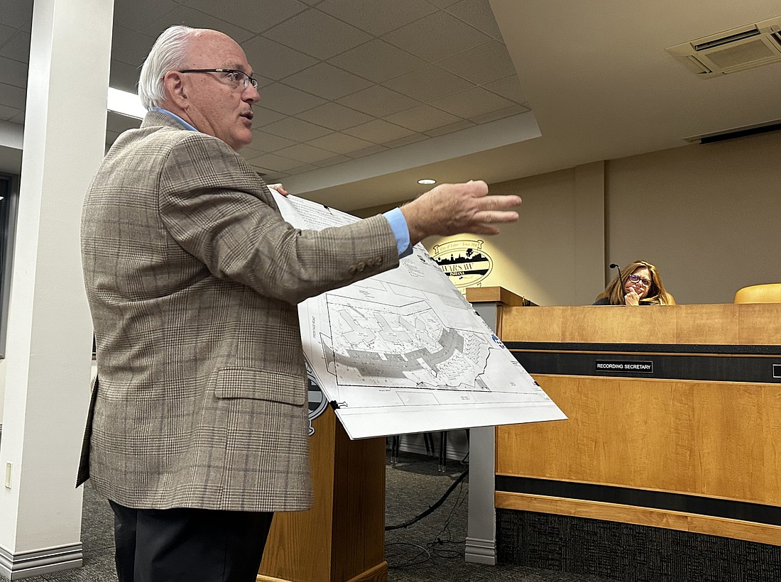 Jerry Nix, MKM architecture + design, Fort Wayne, shows the Warsaw Board of Zoning Appeals the plans for the property at 3090 Frontage Road on Monday. Photo by David Slone, Times-Union