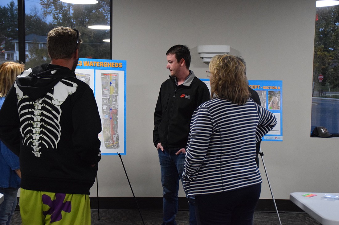 Michael Voll, a senior staff engineer with Jones Petrie Rafinski (C), chats with Will Bennett (L) and Syracuse Town Councilwoman Cindy Kaiser at a public information meeting about a conceptual trail. The meeting was held Monday at the Syracuse Town Council. Photo by Lauren Zeugner, InkFreeNews