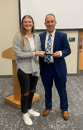 Manchester University student Makaila Geese recently presented an award to Dr. Michael Cotton, clinical pharmacist at VA Northern Indiana Health Care System, as Manchester University’s Preceptor of the Year for Introductory Pharmacy Practice Experience rotations. Photo Provided.