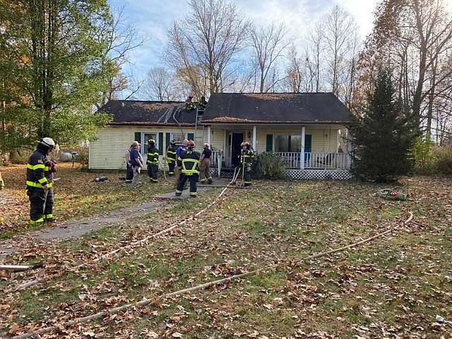 Firefighters respond to a reported fire Wednesday afternoon at the home of James Hurd, 5717 W. Quail Drive, Mentone. Photo Provided by Kevin McSherry, Burket Fire Department Chief