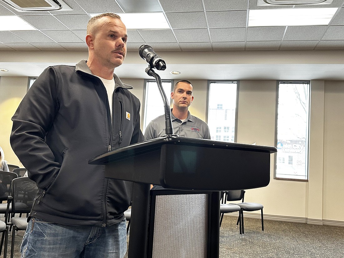 Warsaw-Wayne Fire Territory Dive Commander and Capt. Drew Shilling (L) asks the Board of Public Works and Safety on Friday for permission to apply for a K21 Health Foundation grant while Fire Chief Joel Shilling (R) looks on. Photo by David Slone, Times-Union